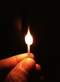 Close-up of lit candle