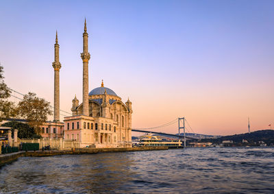 Bridge over river against clear sky