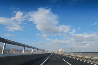 Bridge over road against sky