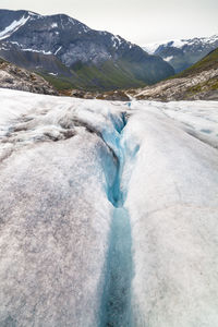 Crevasse on haugabreen glacier against mountains