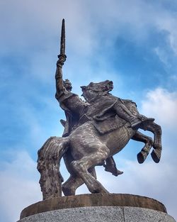 Low angle view of statue against sky