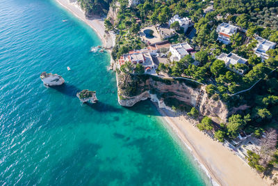 High angle view of townscape by sea