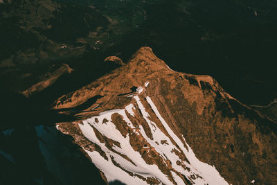Aerial view of snowcapped mountains during winter