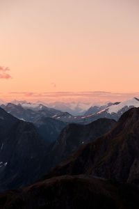 Scenic view of mountains against sky during sunset