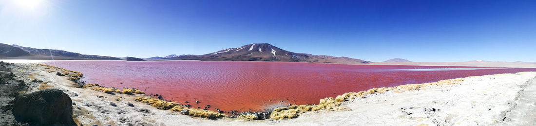 Panoramic view of mountain range against clear blue sky