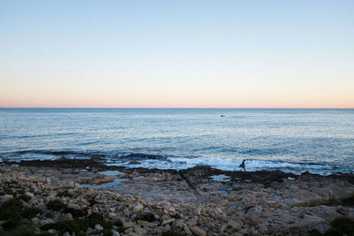 Scenic view of sea against clear sky