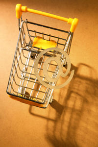 High angle view of yellow metal on table