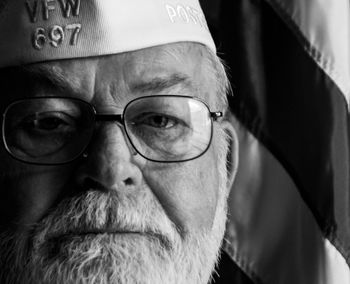 Close-up portrait of man wearing eyeglasses