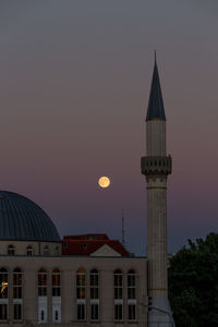 Mosque against sky at night