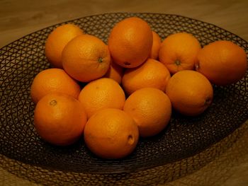 High angle view of oranges in bowl on table