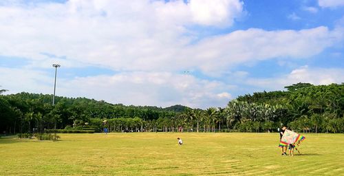 Group of people on grassy field