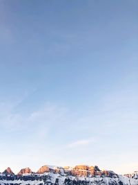 Scenic view of snowcapped mountains against clear blue sky