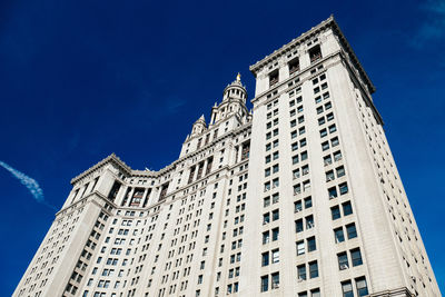 Low angle view of building against blue sky