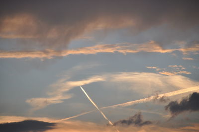 Low angle view of vapor trails in sky