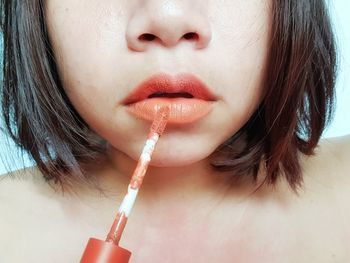 Close-up of beautiful woman drinking water
