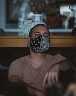 Portrait of man sitting at home