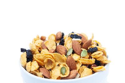 Close-up of fresh fruits in bowl against white background