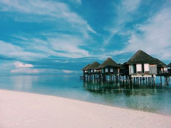 Scenic view of calm sea against cloudy sky