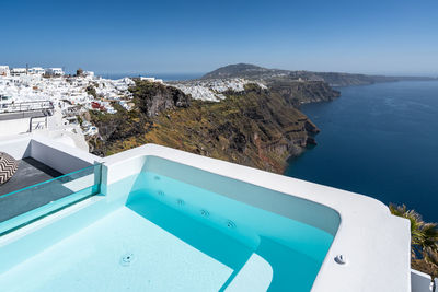 A jacuzzi in santorini with a stunning view over the island, greece