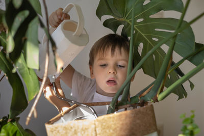 High angle view of young woman standing by plants