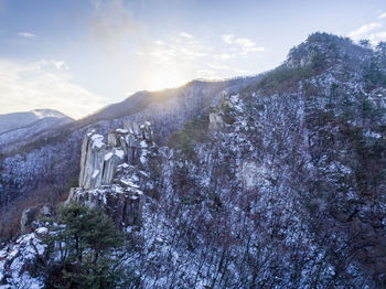 Scenic view of snowcapped mountains against sky