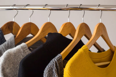 Close-up of clothes hanging on rack