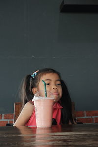 Girl with coffee on table sitting in cafe