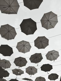 Black and white umbrellas on the sky