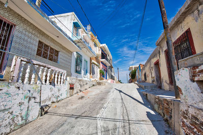 Narrow street amidst buildings in town