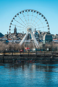 Low angle view of ferris wheel  structures against sky