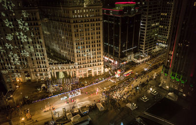 High angle view of illuminated buildings in city at night