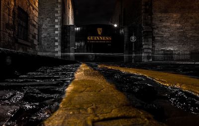 Illuminated text on road at night