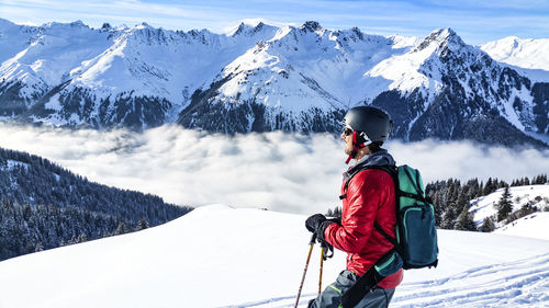 Man skiing on snow covered mountain