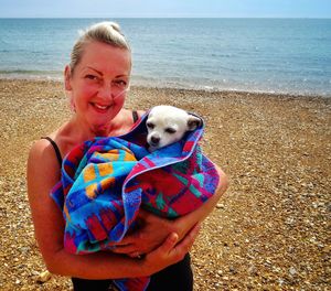 Man with dog on beach