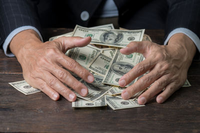 Close-up of hands holding camera