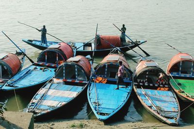 Boats moored in lake