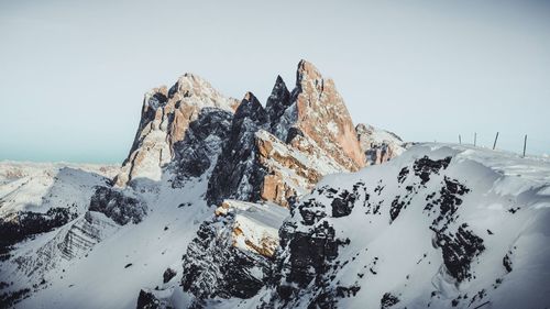 Scenic view of snowcapped mountain against clear sky