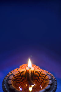 Close-up of lit candles on birthday cake