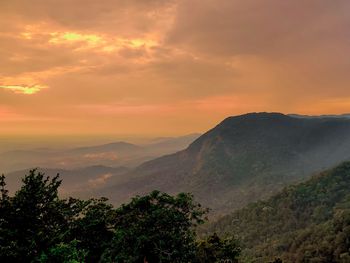 Scenic view of mountains against sky during sunset