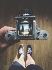 Man photographing through camera