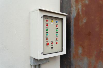 Close-up of telephone booth on wall