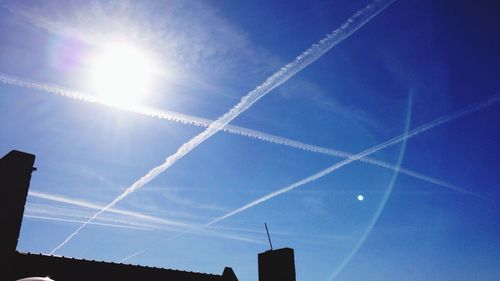 Low angle view of vapor trails in sky