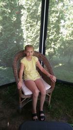 Portrait of teenage girl sitting on seat