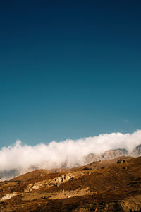 Scenic view of landscape against blue sky