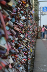 Padlocks hanging on railing