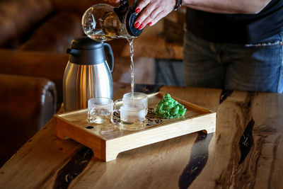 Close-up of wine glasses on table