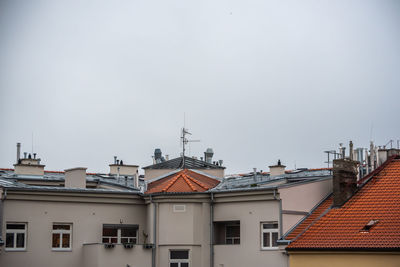 High section of buildings in city against clear sky