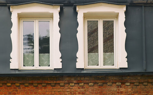 Low angle view of window on wall of building