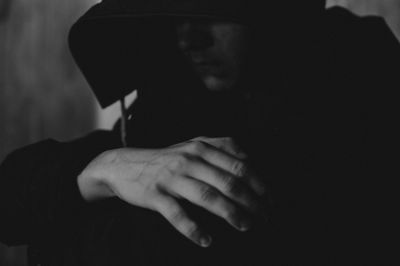 Close-up portrait of man holding hands