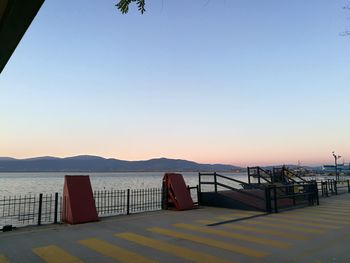 Scenic view of sea against clear sky during sunset